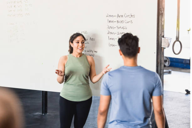 CrossFit instructor explaining workout