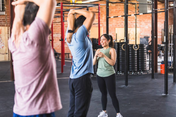 CrossFit community stretching together